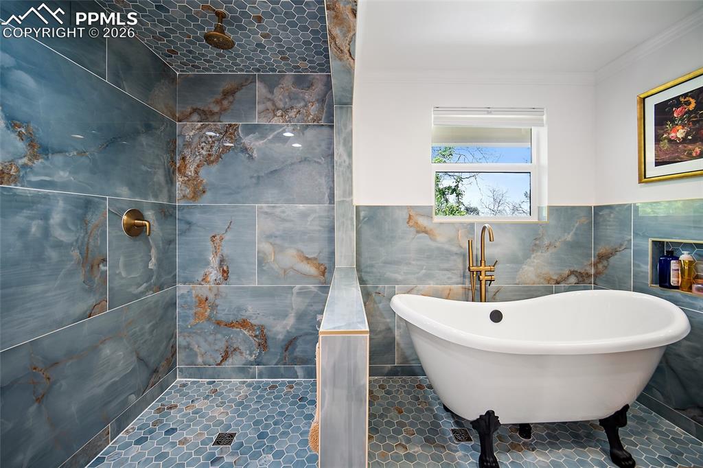 Image 31 of 50: Huge walk-in shower fully tiled and beautiful!