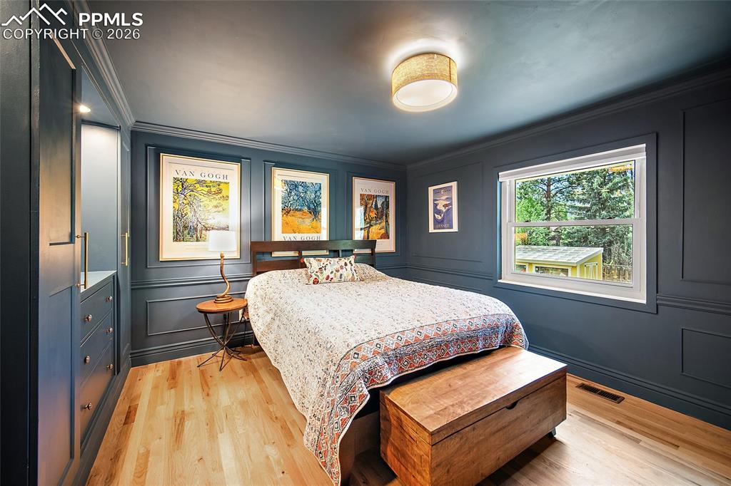 Image 34 of 50: Upper-Level bedrooms with built ins. 