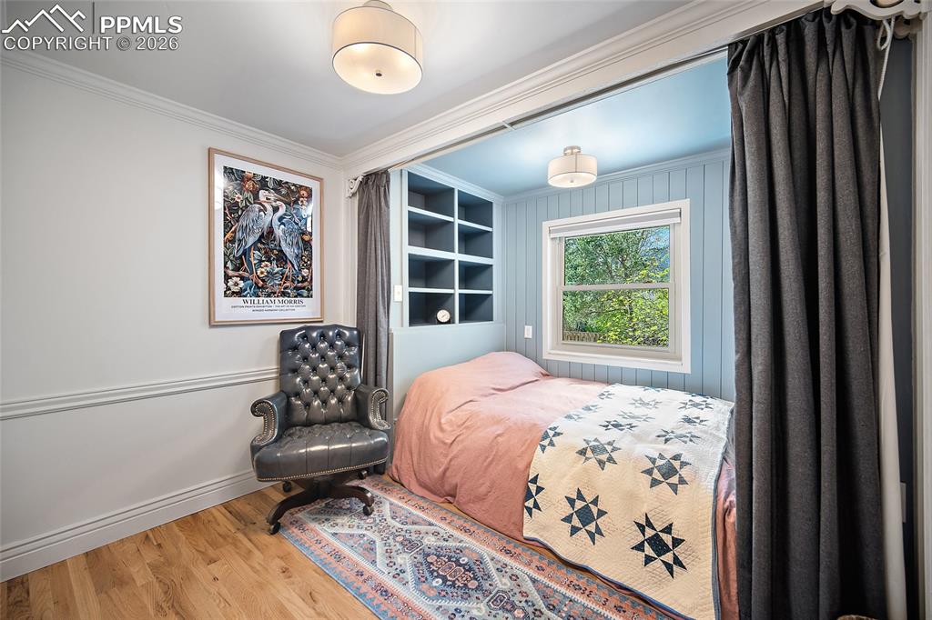 Image 37 of 50: This bedroom is sweet with built in bed! 