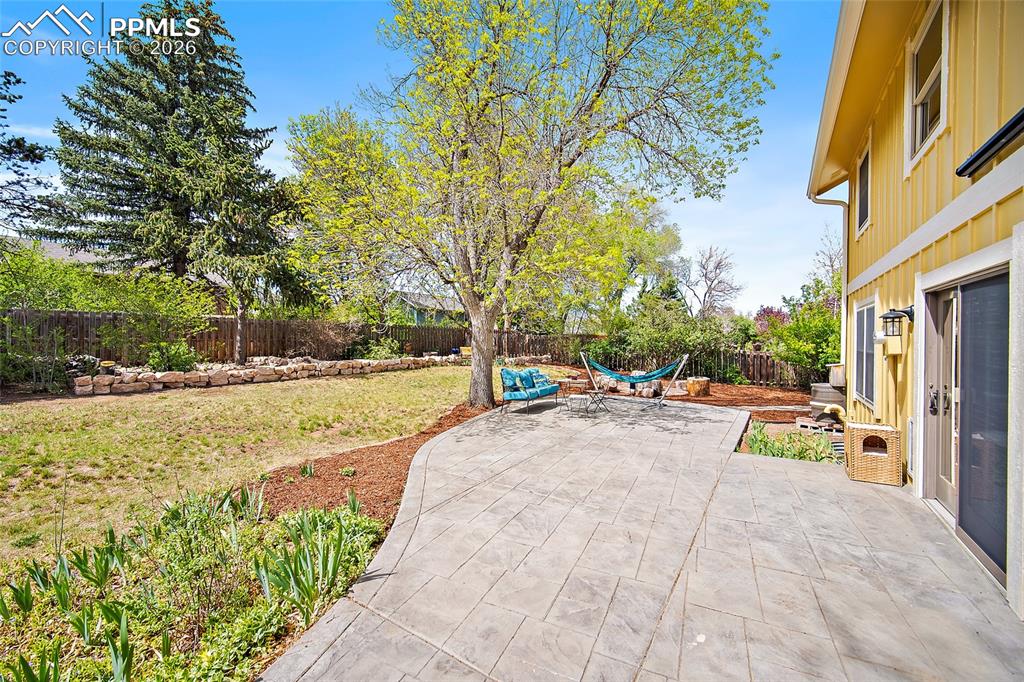 Image 4 of 50: New poured patio! Wonderful backyard. 