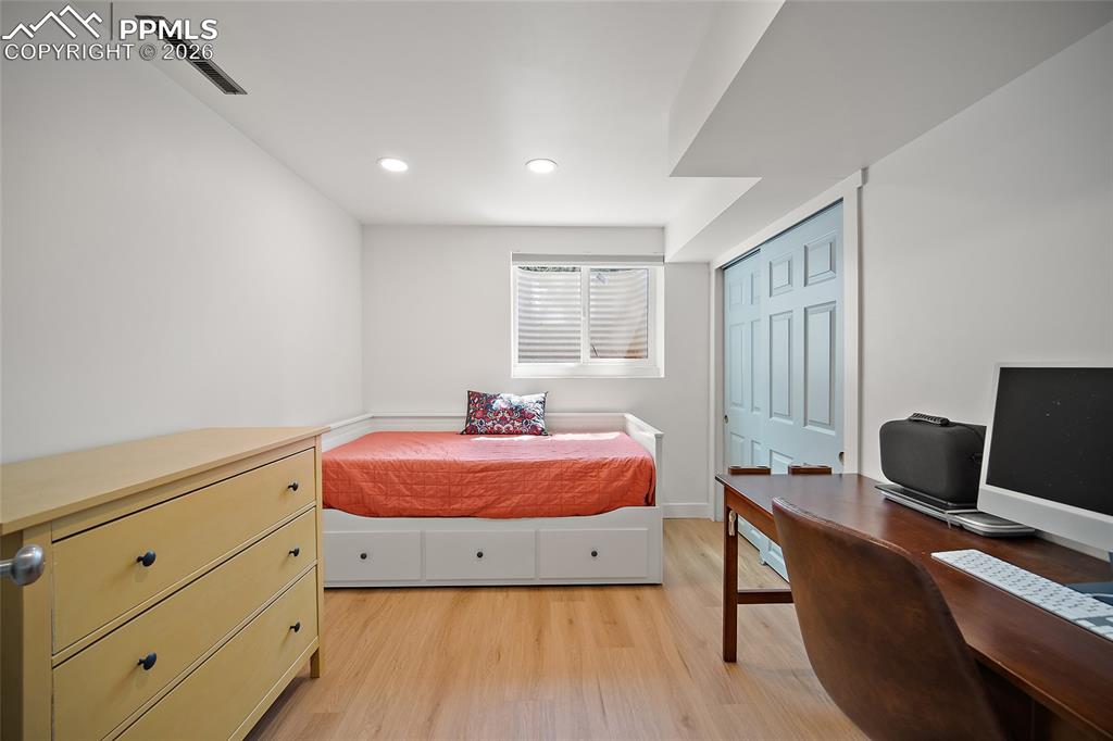 Image 43 of 50: Lower-level Bedroom.  Added insulation above in both of the lower-level bed