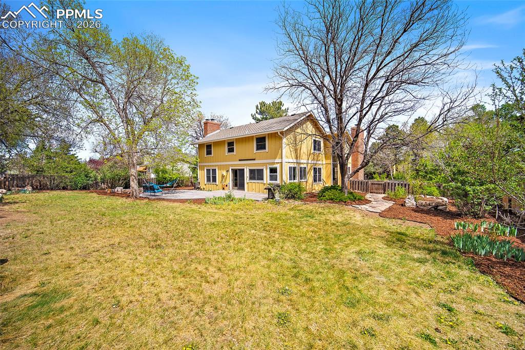 Image 46 of 50: Garden - there is a projector on the outside of the house for summer movie 