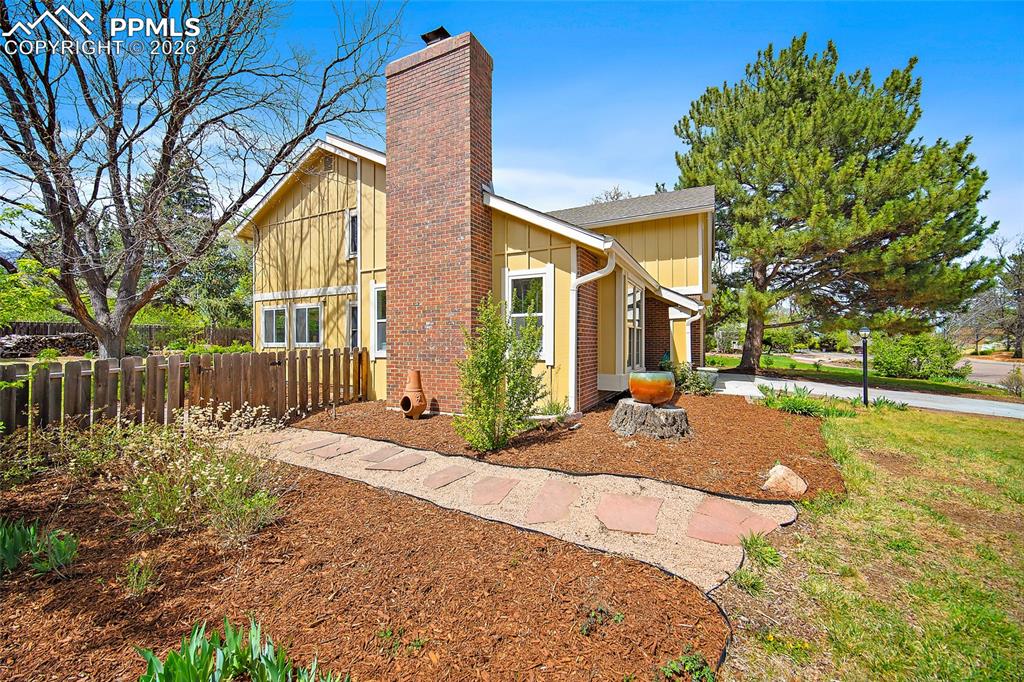 Image 49 of 50: Flagstone leading to the backyard. 
