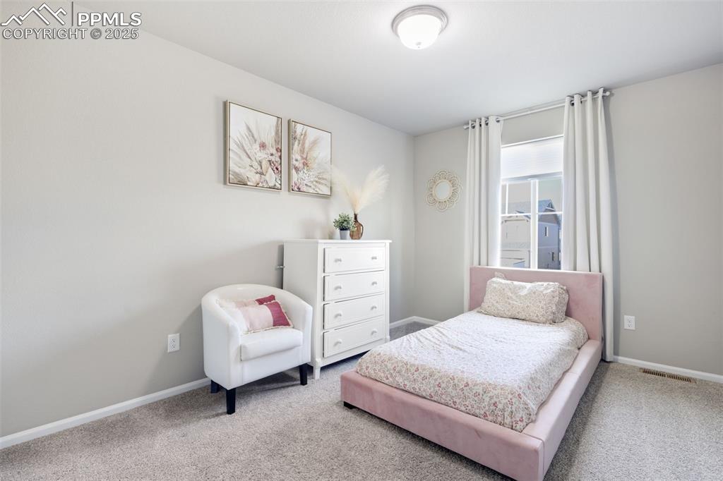 Image 22 of 39: Carpeted bedroom featuring baseboards