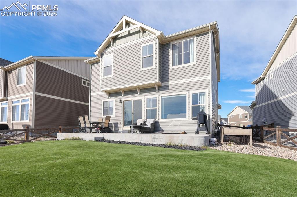 Image 34 of 39: Rear view of house featuring a patio area