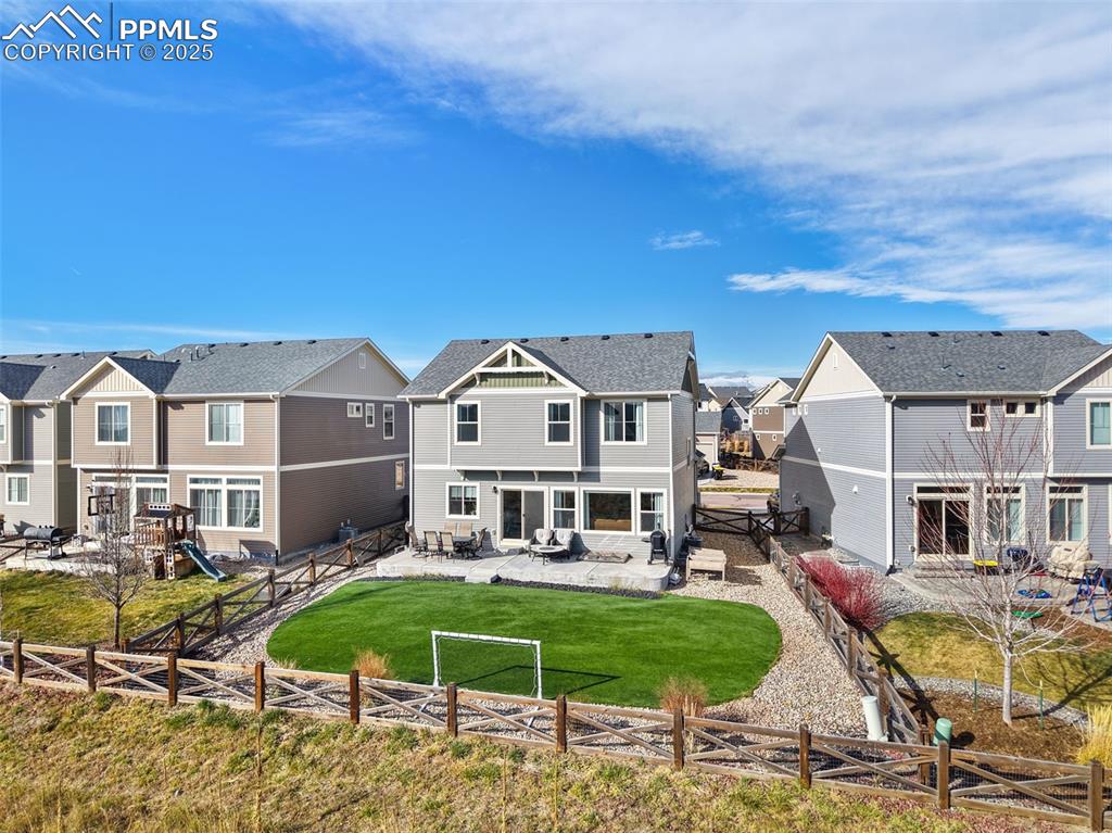 Image 37 of 39: Rear view of property with a patio area, a residential view, a fenced backy