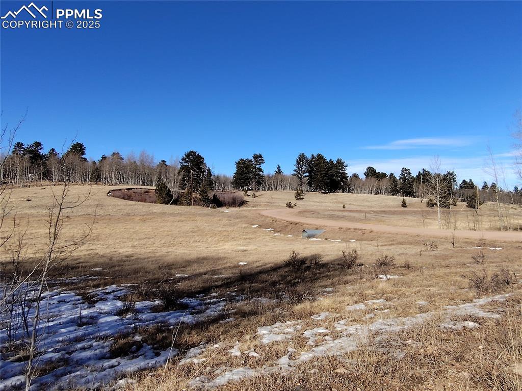 Caption: Full 2.1 Acre corner parcel. Meadow with southwestern exposure. 