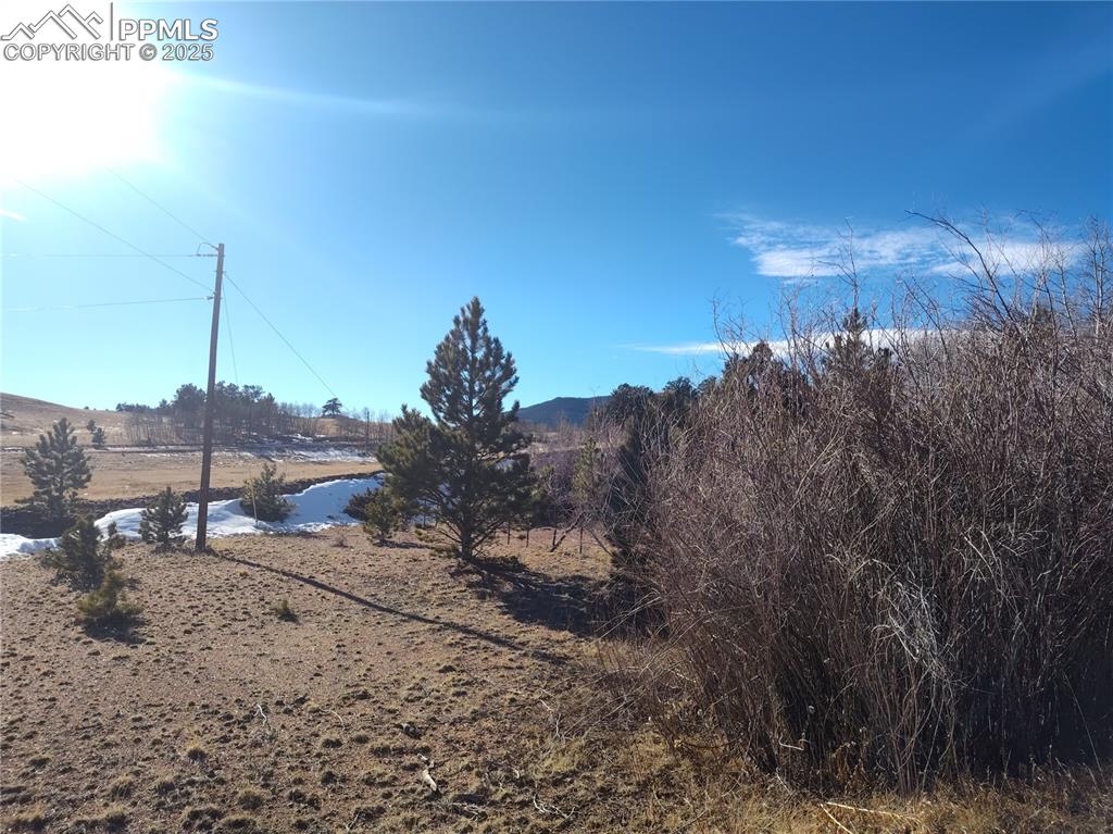 Image 10 of 20: Central lot portion with power pole and western mountain views. 
