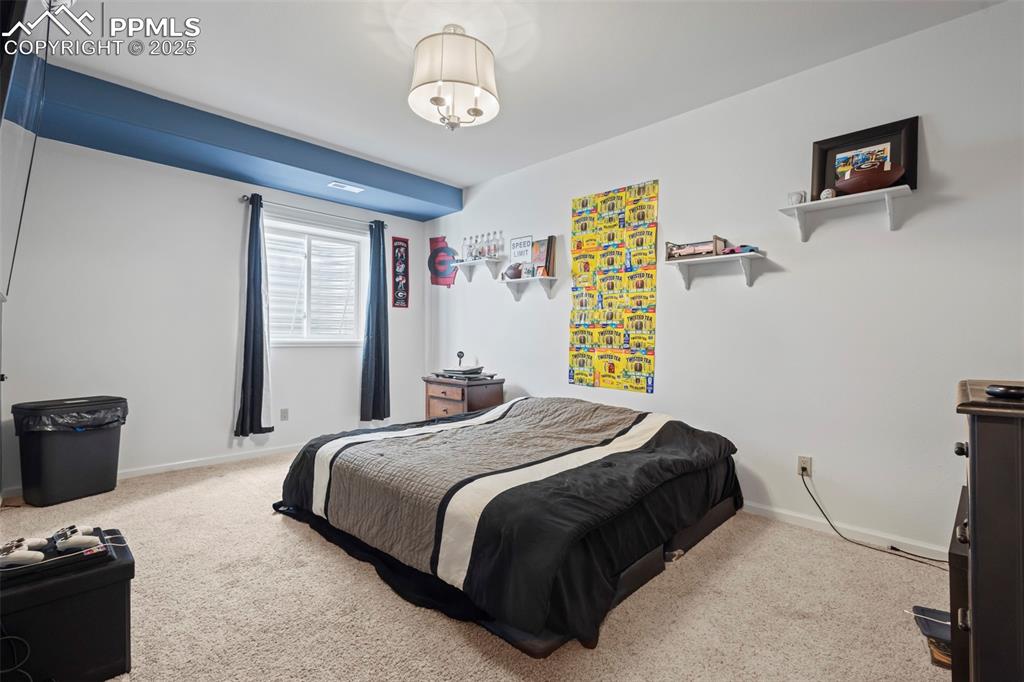 Image 44 of 49: Bedroom featuring carpet flooring and baseboards