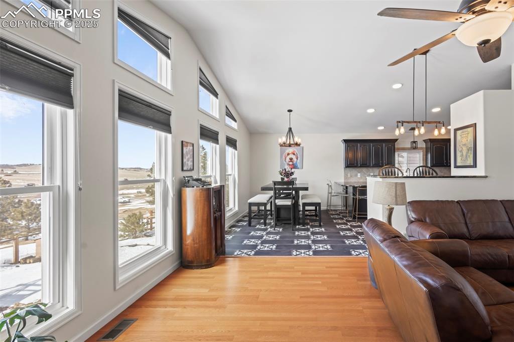 Image 9 of 49: Living area featuring recessed lighting, plenty of natural light, visible v