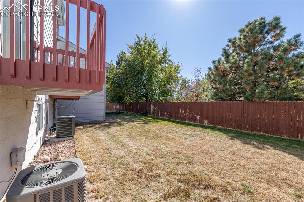 Image 29 of 31: View of fenced backyard