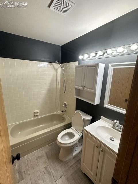 Image 23 of 24: Bathroom featuring vanity and shower / washtub combination
