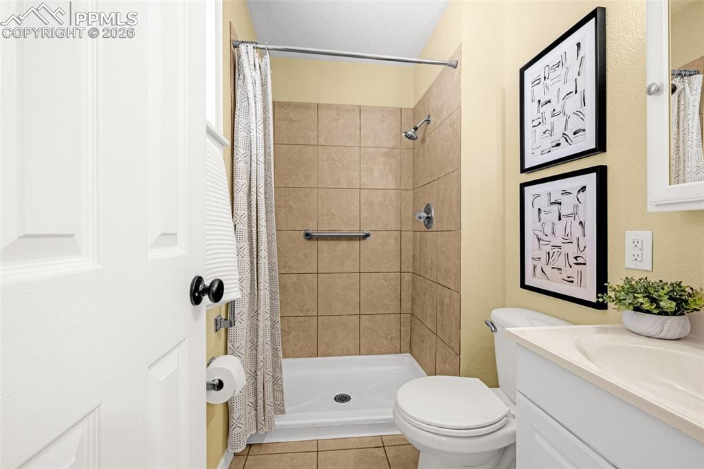 Image 11 of 21: primary bath with standing shower