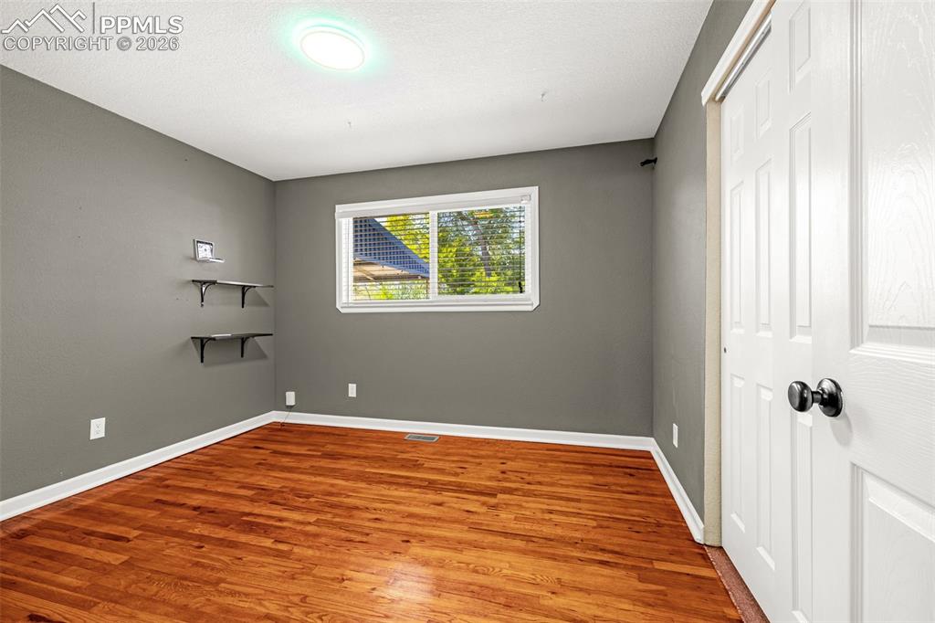 Image 12 of 21: Third bedroom speedy fiber optic wiring and wood floor