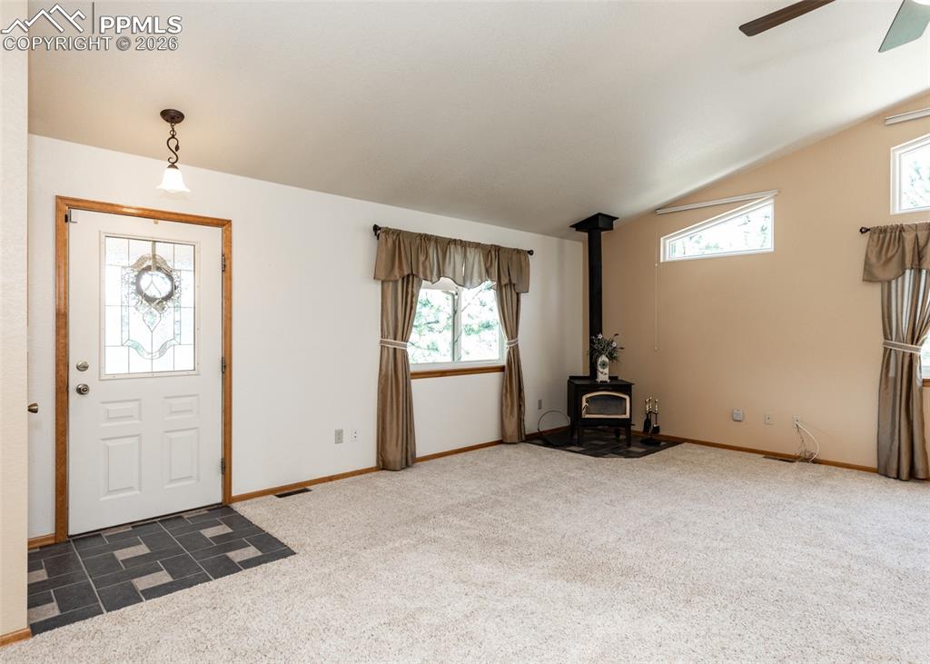 Image 14 of 50: Enter into the cozy living/family room.