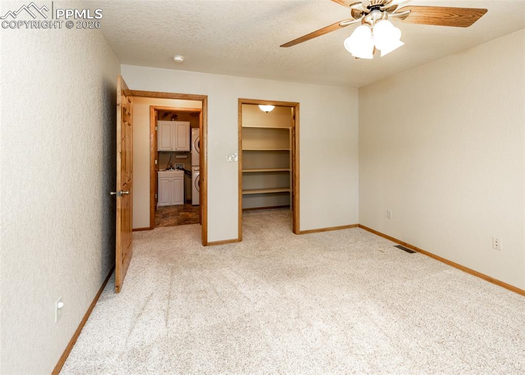 Image 35 of 50: This secondary bedroom (2) also has a walk-in closet! Perfect for an office