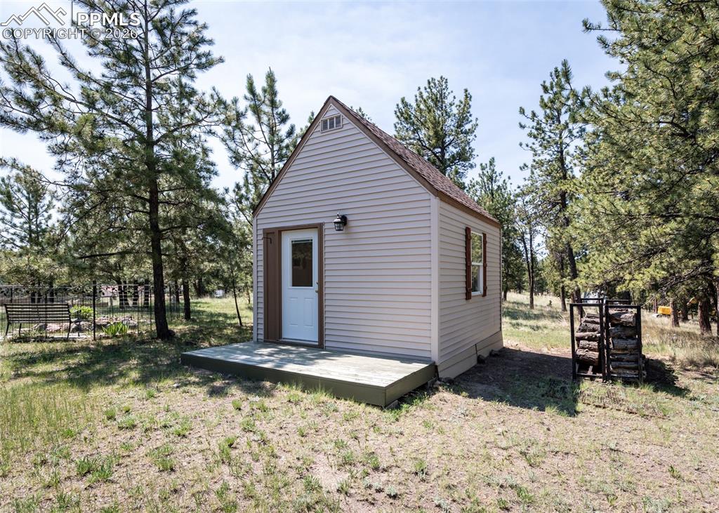 Image 42 of 50: This 192 sq.ft craft/guest cottage is a sweet addition to the property. Wha