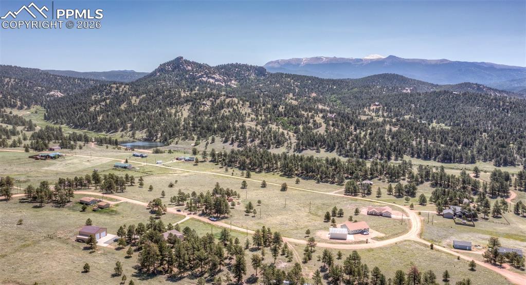 Image 48 of 50: Surrounded by mountains and trees.