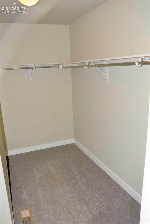 Image 7 of 12: Master bedroom walk-in closet