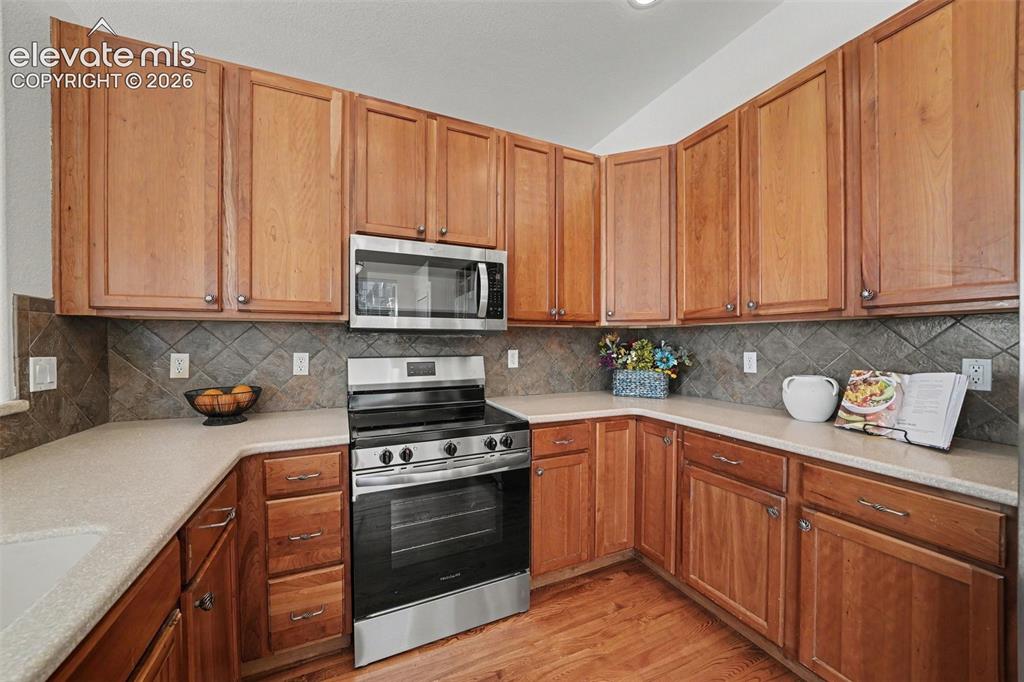 Image 10 of 41: Spacious kitchen with abundant countertop and cabinet space and ceramic til