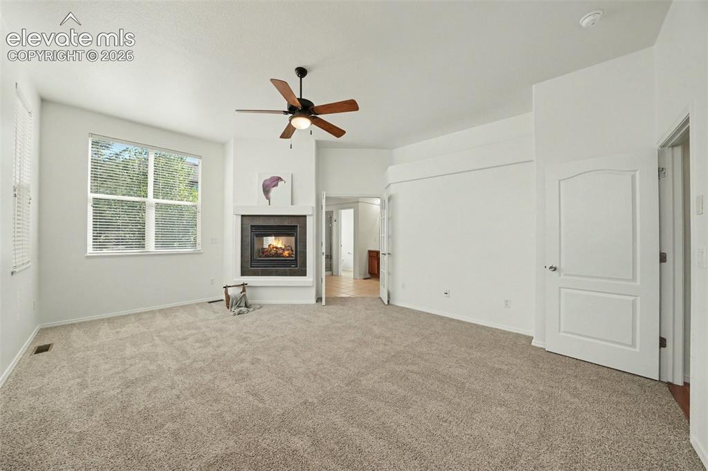 Image 16 of 41: Luxurious primary suite with brand-new carpet.