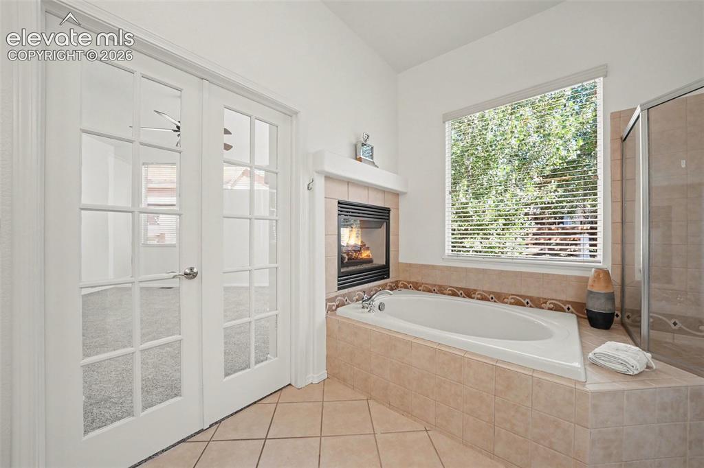 Image 19 of 41: Unwind in the soaking tub surrounded by beautiful tile detail and the warmt