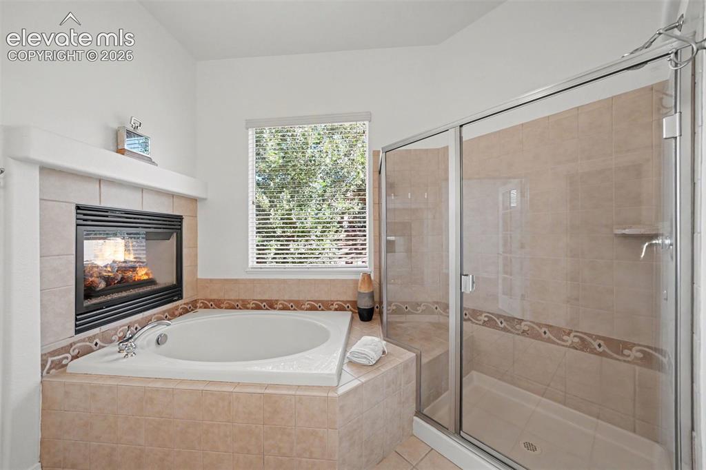 Image 21 of 41: Natural light floods the primary bath.