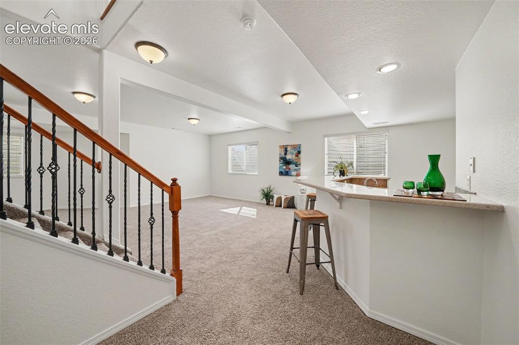 Image 27 of 41: Huge rec room with plenty of space for entertaining and relaxing.