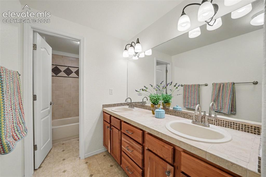 Image 37 of 41: Second bathroom in the basement is ideally located between the 2 bedrooms.