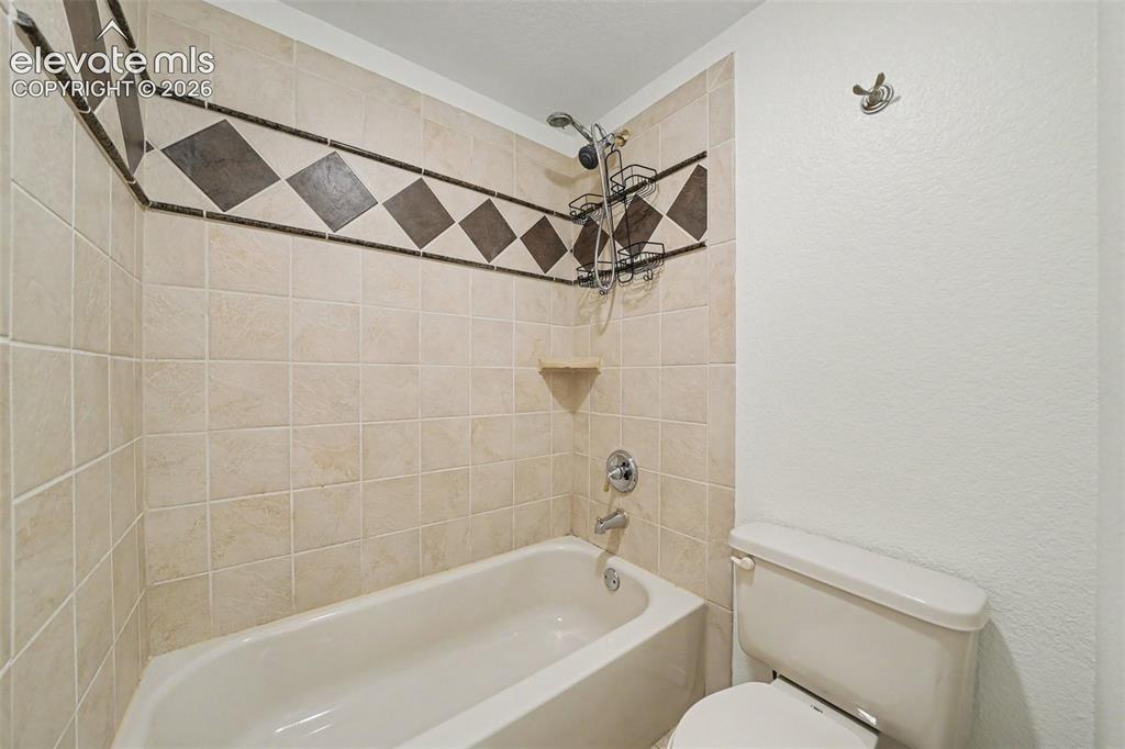 Image 38 of 41: Beautiful tile in basement bath.