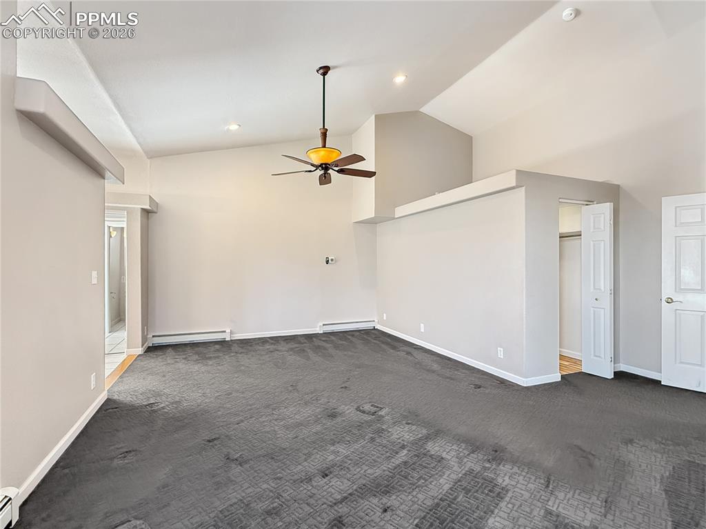 Image 17 of 50: Primary has enough rom for a sitting area, closet to the right