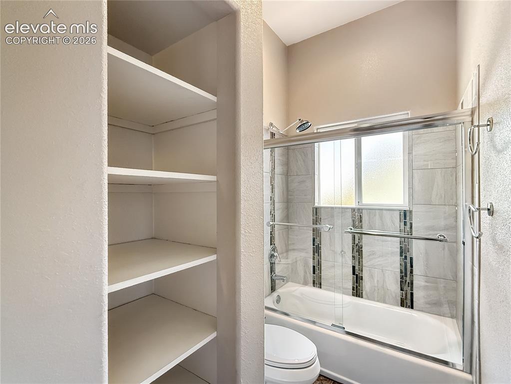 Image 27 of 50: Plenty of storage in this jack and jill bath