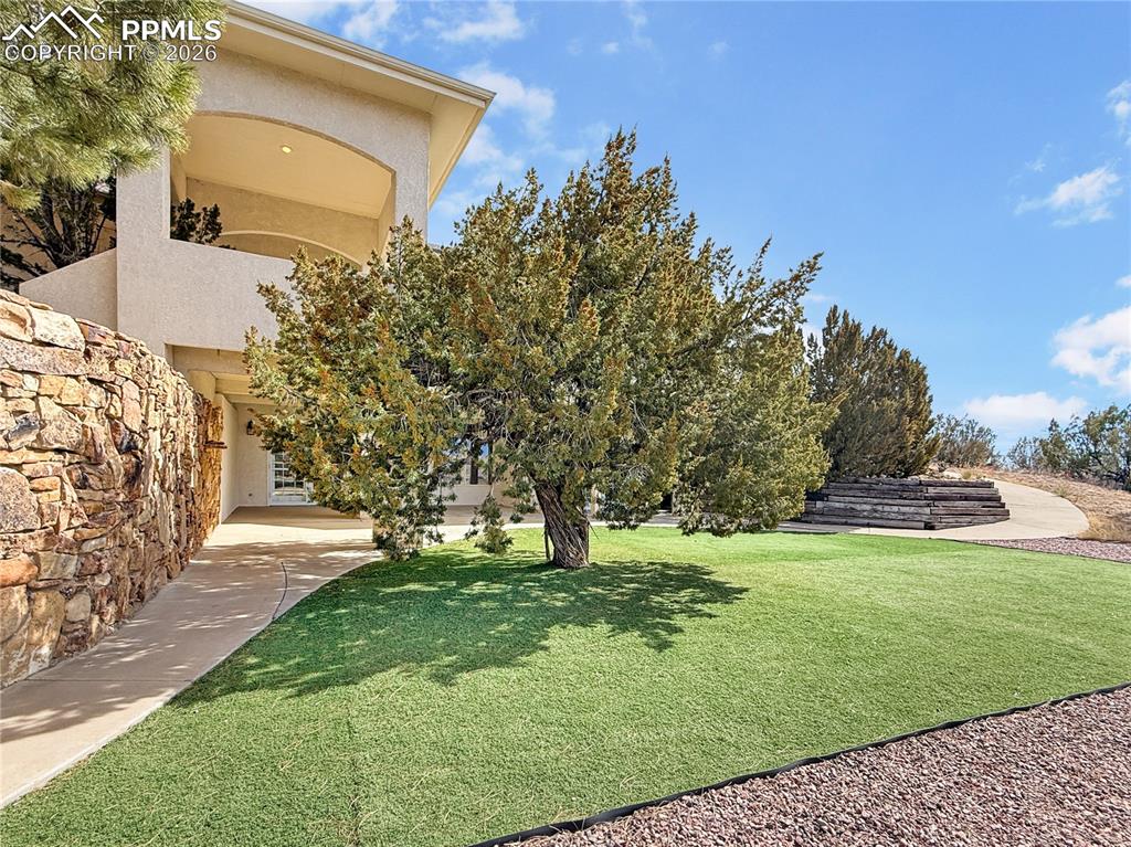 Image 35 of 50: front view beside grand stone stairs