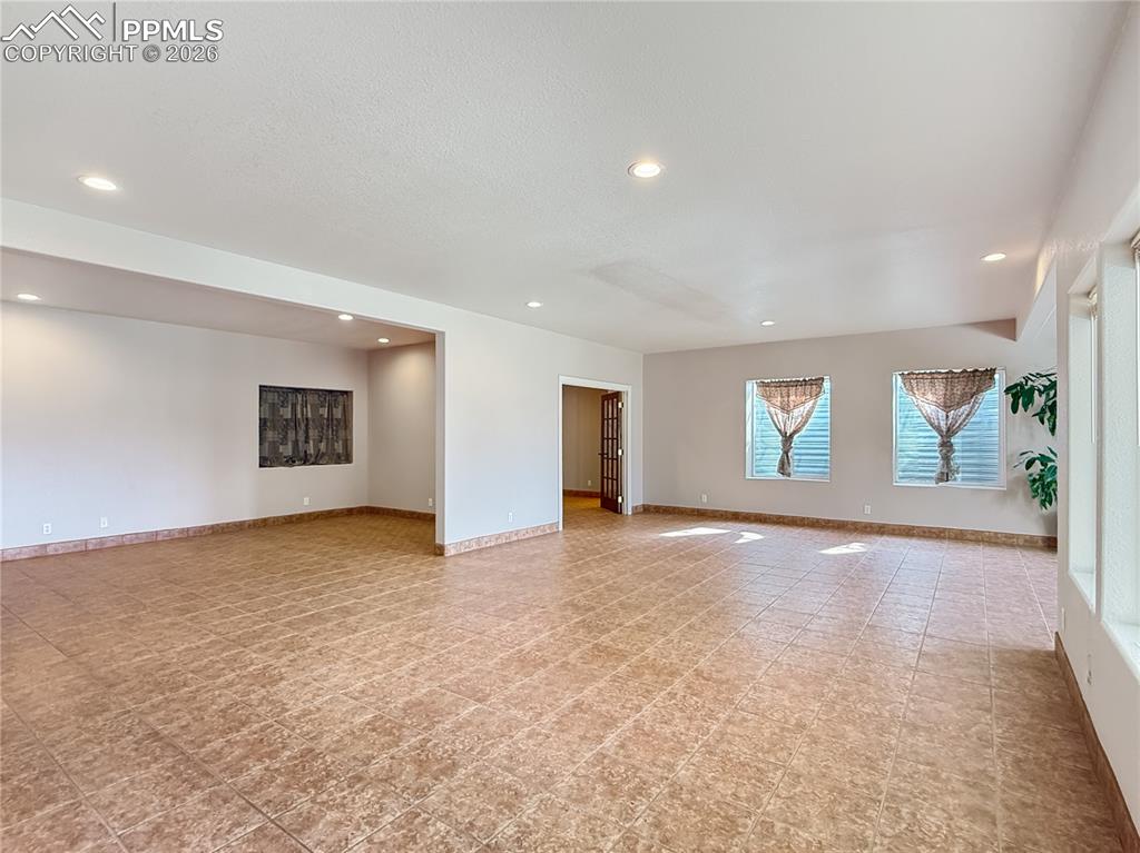 Image 41 of 50: Huge family room with plumbing for a wet bar/kitchen area