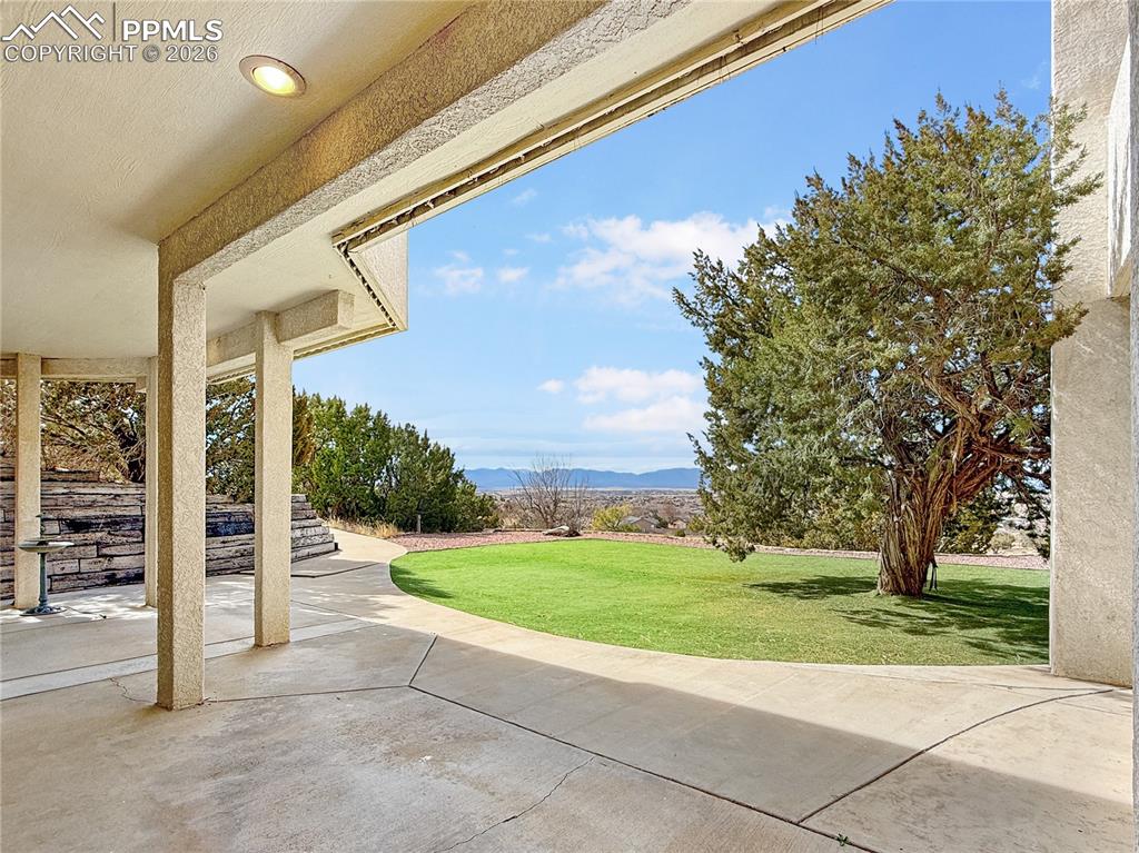 Image 43 of 50: Walk out to lower patio and more great views