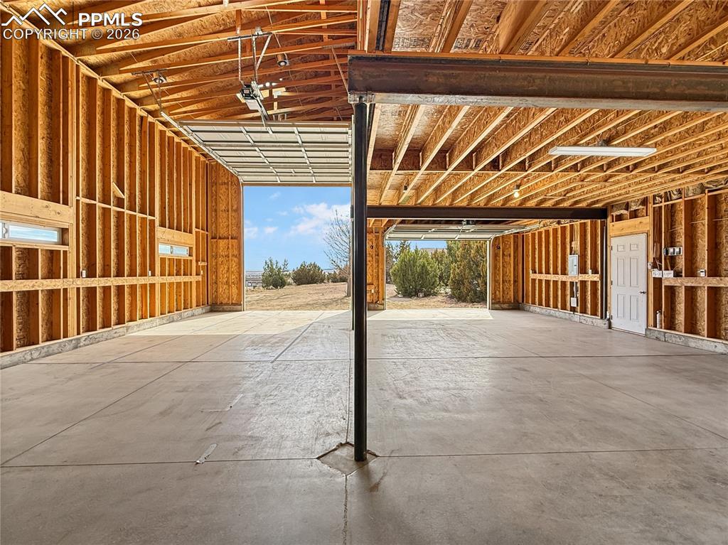 Image 45 of 50: Detached garage looking from back to front, notice the extra large door for