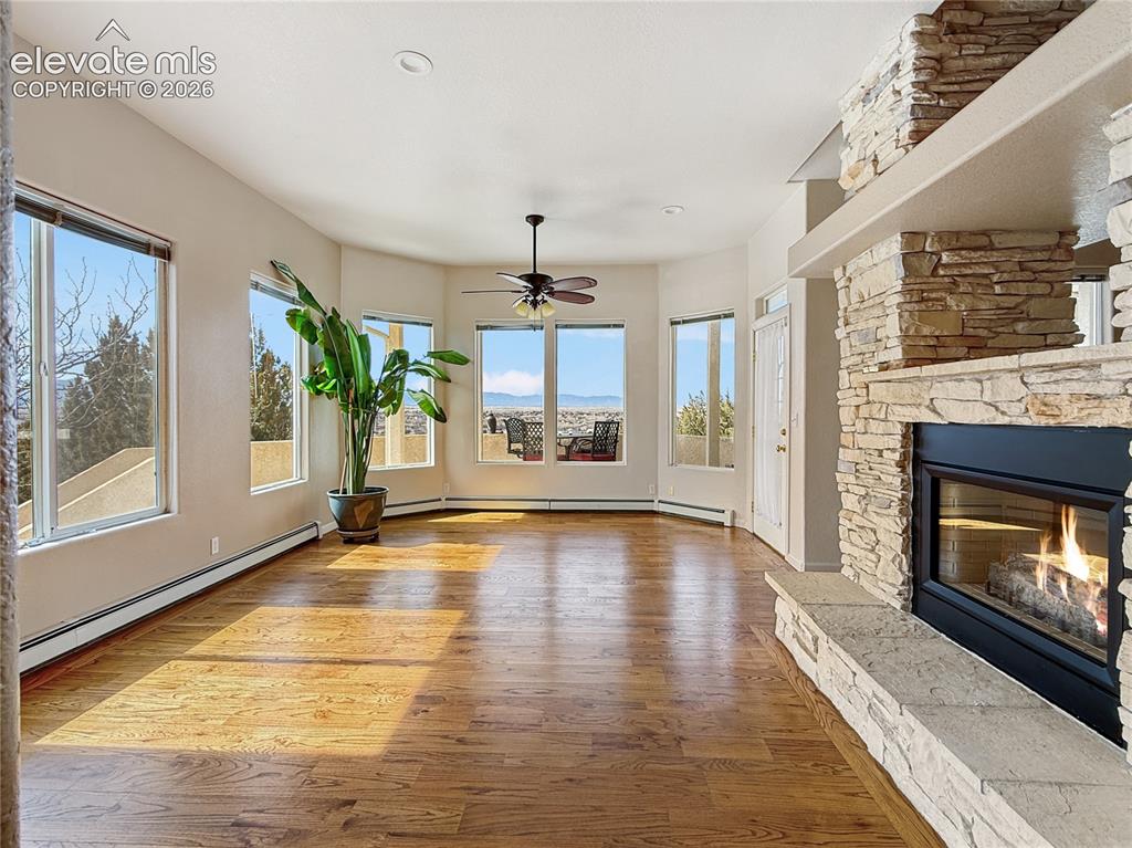 Image 9 of 50: Beautiful formal dining area with bay windows and fireplace as well as an e