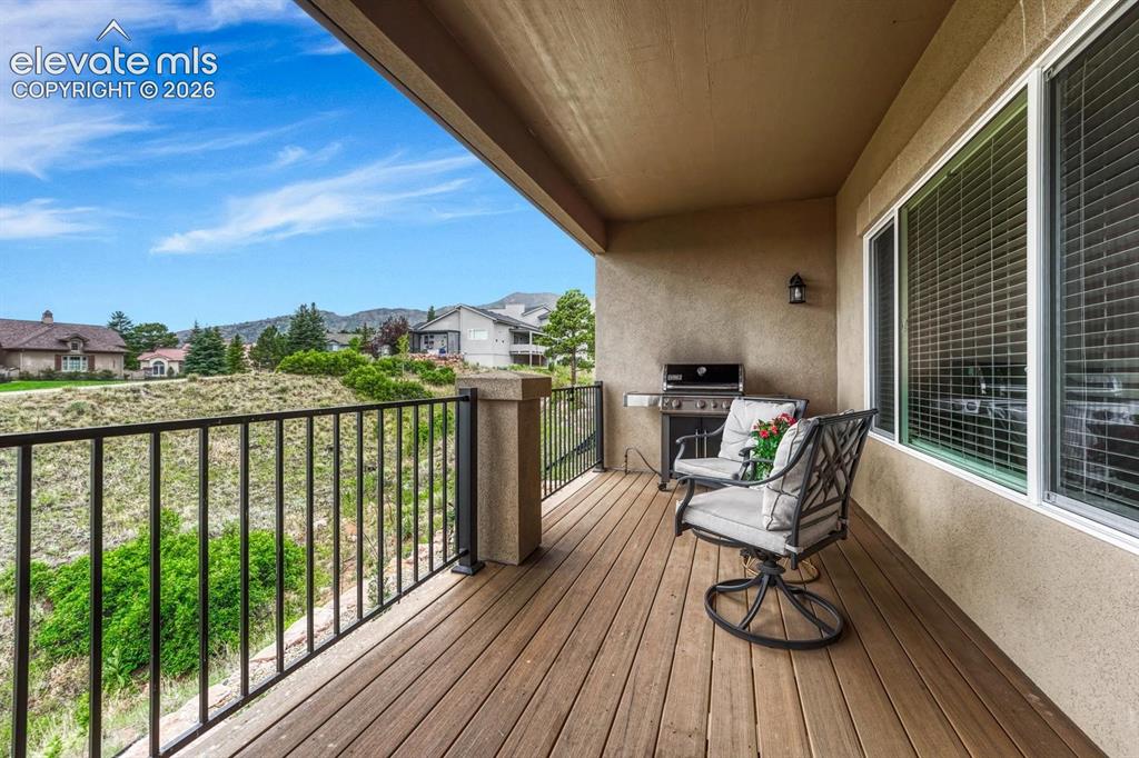 Image 12 of 50: Covered composite deck with gas line and mountain views