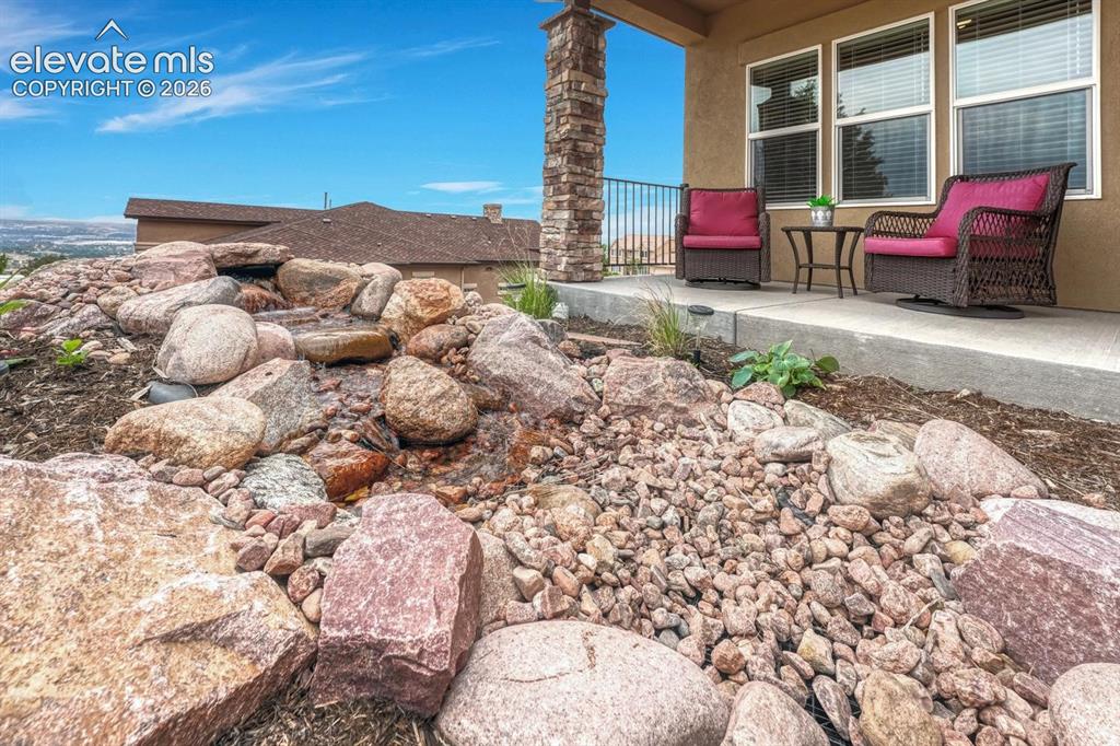 Image 49 of 50: Cascading water feature at the front entry