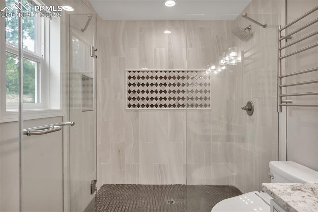 Image 22 of 50: Full bath featuring a shower stall and vanity