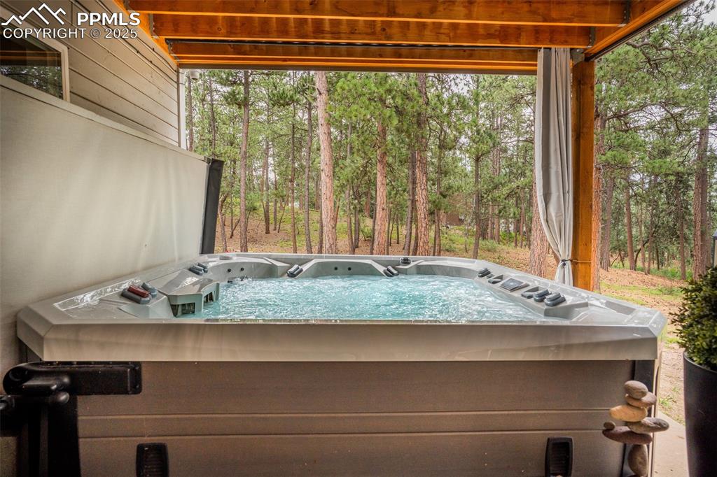 Image 45 of 50: Unfurnished sunroom with a jacuzzi