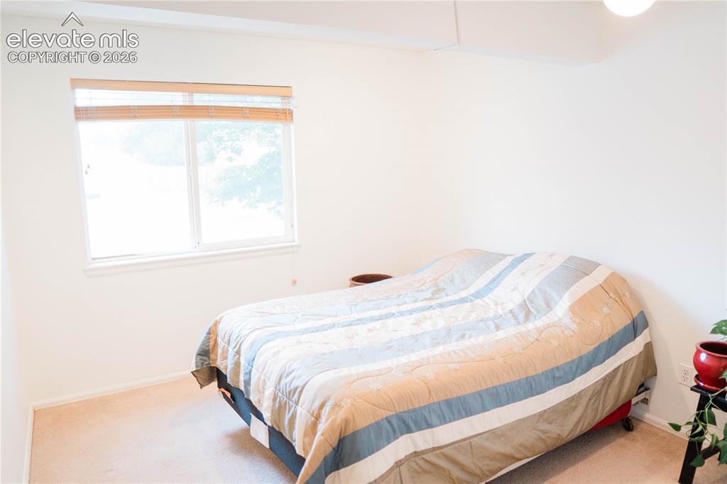 Image 15 of 34: main level bedroom