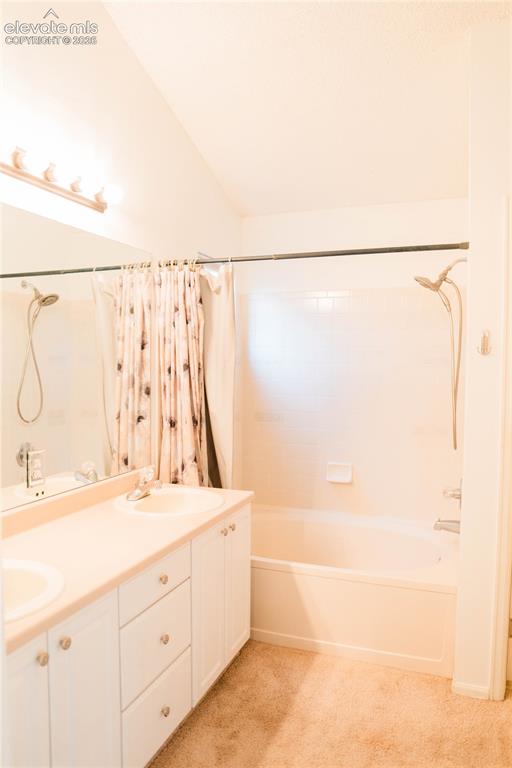 Image 18 of 34: primary bedroom bathroom with walk in closet