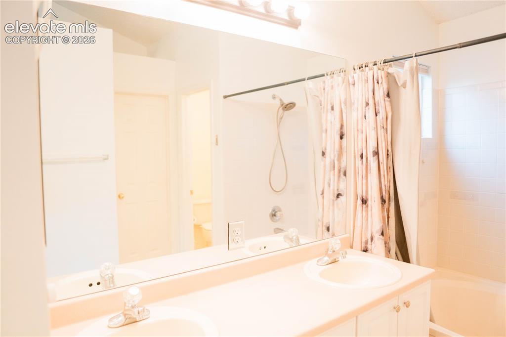 Image 19 of 34: primary bedroom bathroom with private toilet room