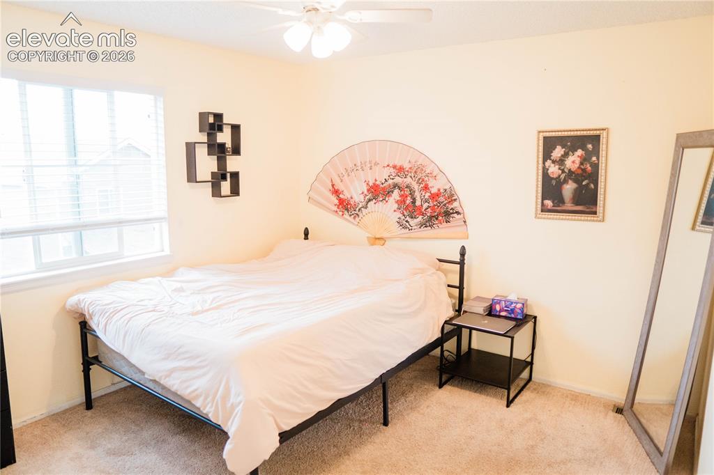 Image 23 of 34: upstairs bedroom at the end of the hallway