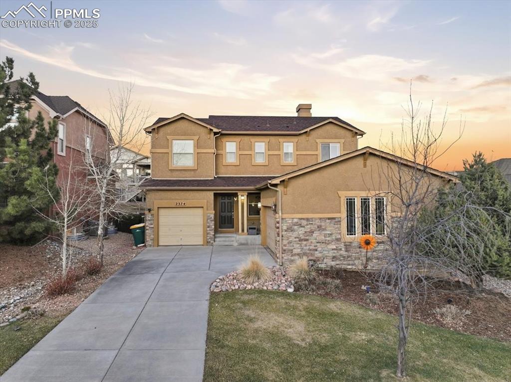 Caption: This beautiful two-story stone and stucco home is just steps from Barefoot Park in Flying Horse. 