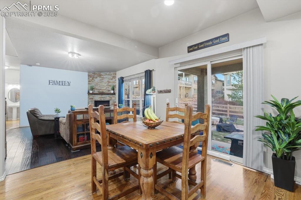 Image 12 of 50: This sliding glass door opens to the back yard and opens automatically with