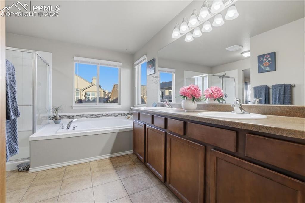 Image 27 of 50: Dual vanities and LOTS of counter space make this an easy spot for two peop