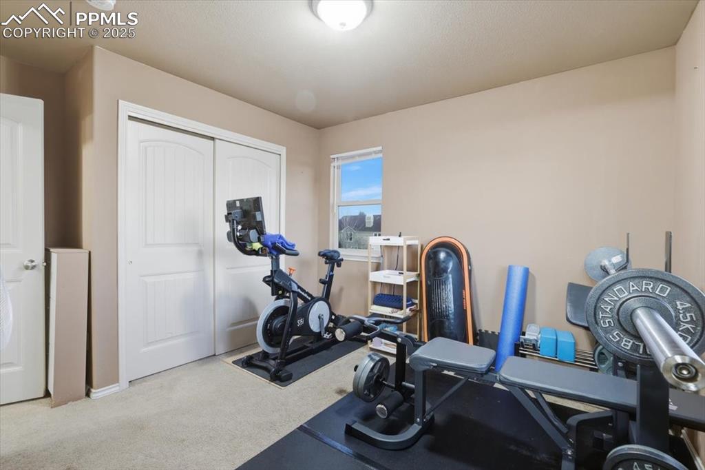 Image 36 of 50: The fourth upper level bedroom is a junior suite with a private bath and a 