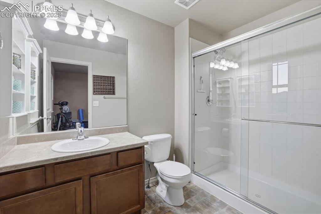 Image 37 of 50: The junior suite has a private 3/4 bath with a large shower. 